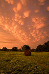 Hay Bale - Texas Sunset Landscape, Mammatus Clouds by Gary Regner